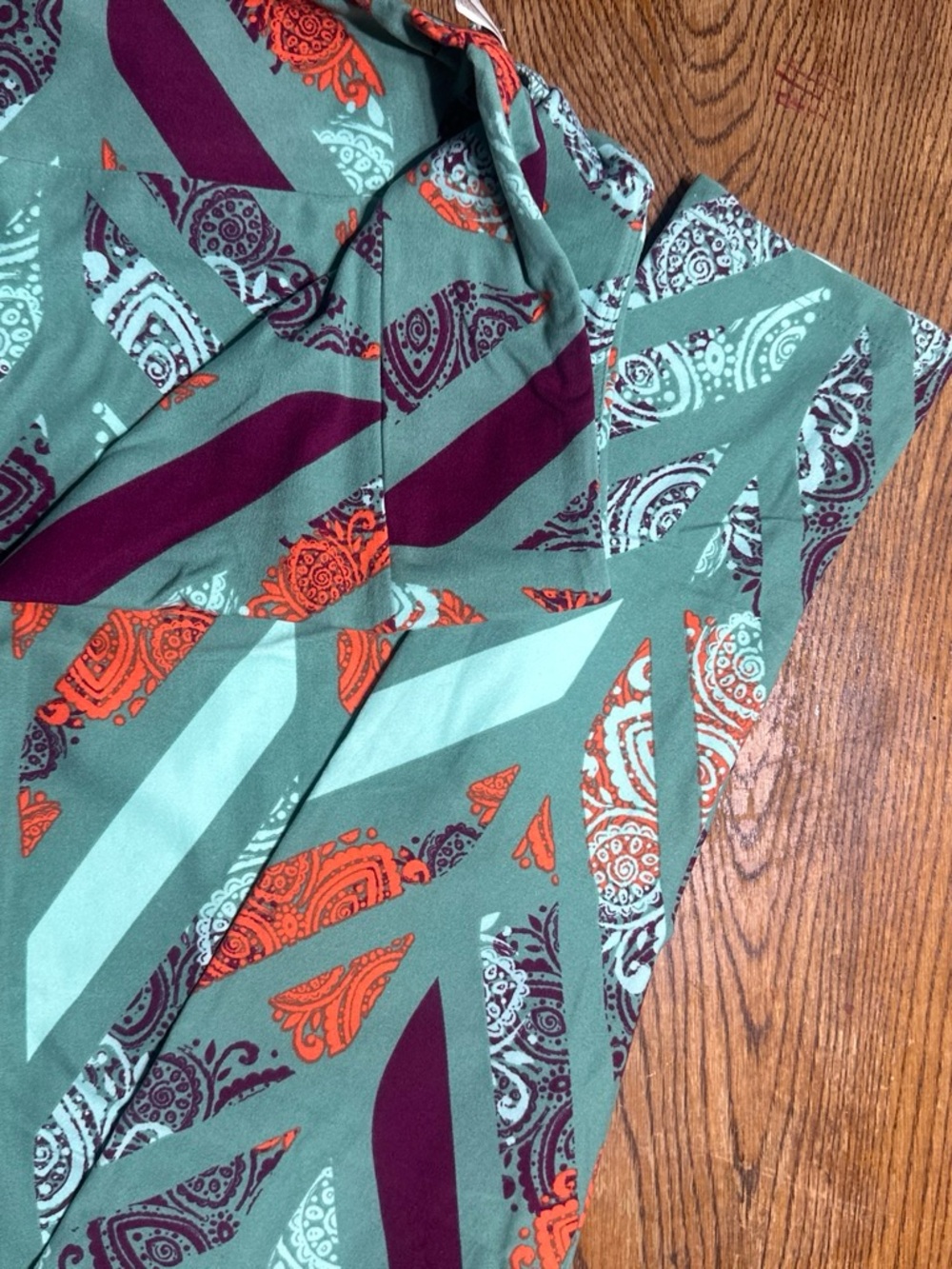 LuLaRoe Mint Green leggings with Orange and Purple Paisley Accents